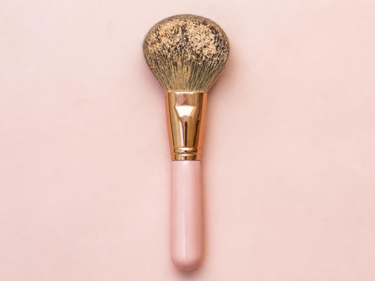 Dirty makeup brushes with product build-up before cleaning